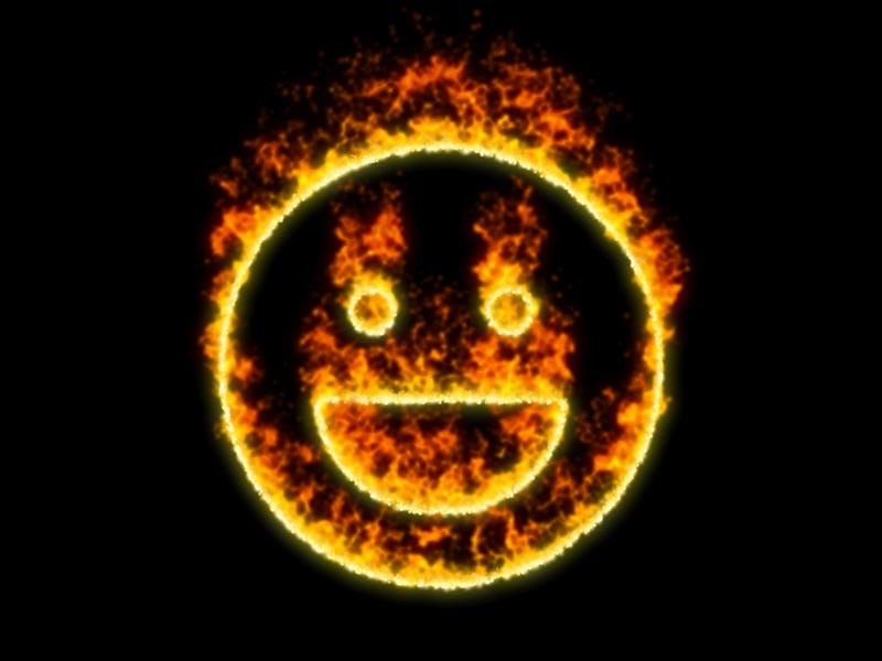 The symbol laugh burns in red fire  