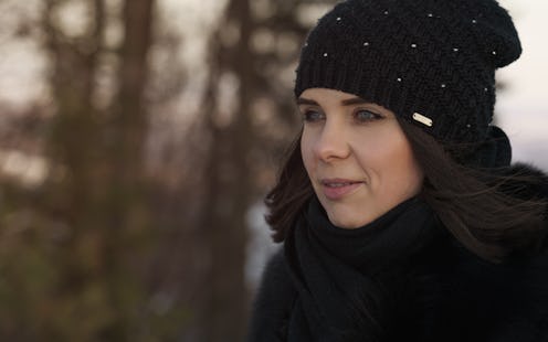 Portrait of woman in hat and winter wear outdoor