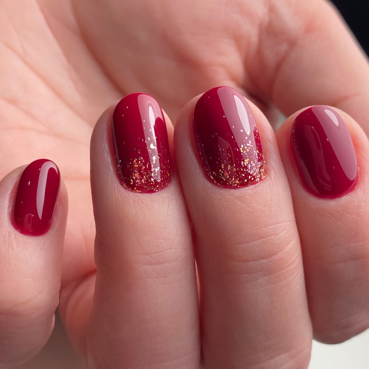 Red gold design nail art in beauty salon