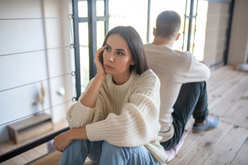 Angry and disappointed. Young dark-eyed wife feeling angry and disappointed after argument with wife
