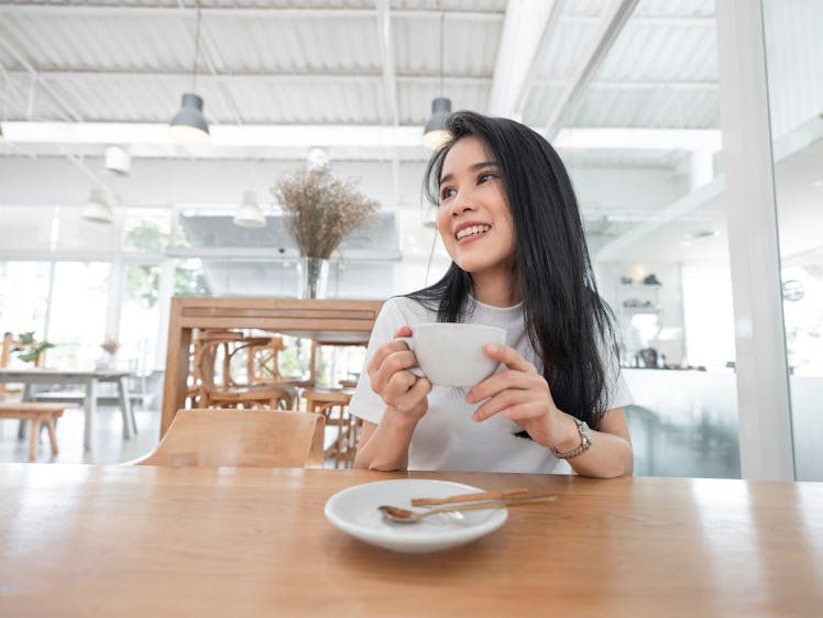 woman in a cafe drinking coffee