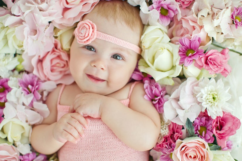 Little baby lying in flowers