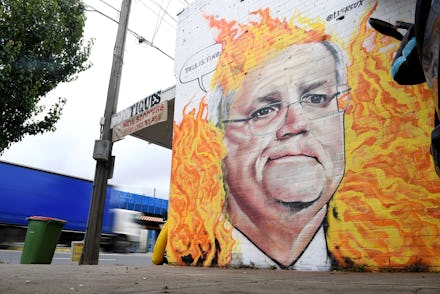 A mural depicting Australian Prime Minister Scott Morrison among bushfire flames is seen in Tottenha...