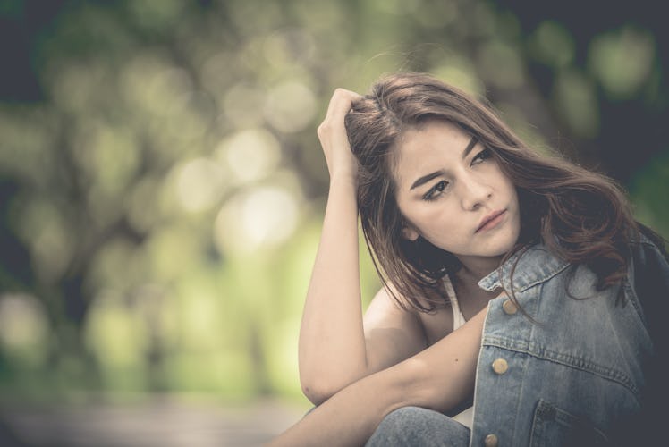 Beautiful thai woman very sad from unrequited love,rethink,think over,vintage style,dark tone,broken...