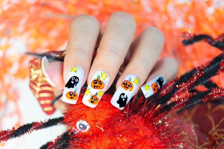 cute lovely orange pumpkin and little black ghost painting on fashionista woman acrylic fingernail,g...