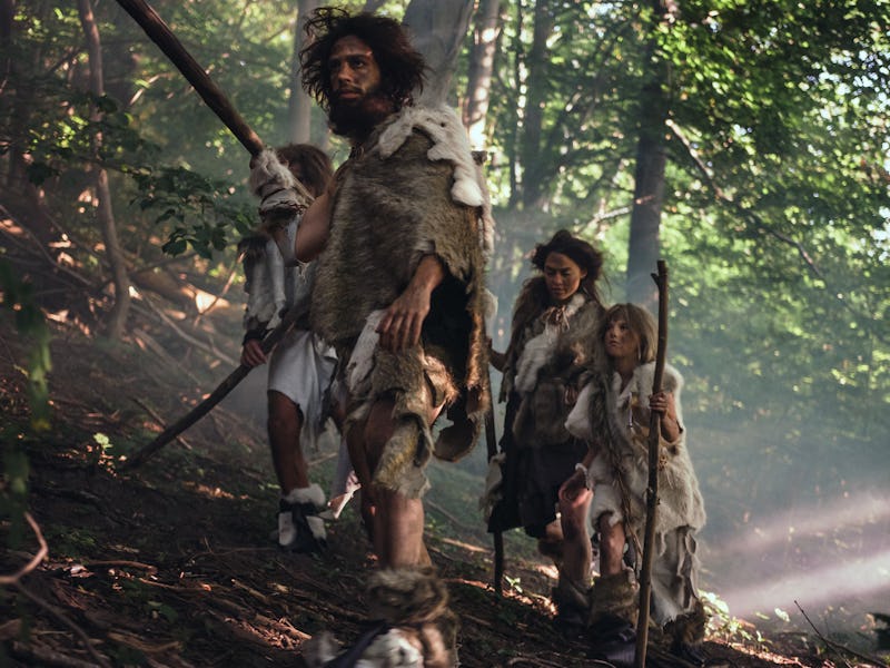 Tribe of Hunter-Gatherers Wearing Animal Skin Holding Stone Tipped Tools, Explore Prehistoric Forest...