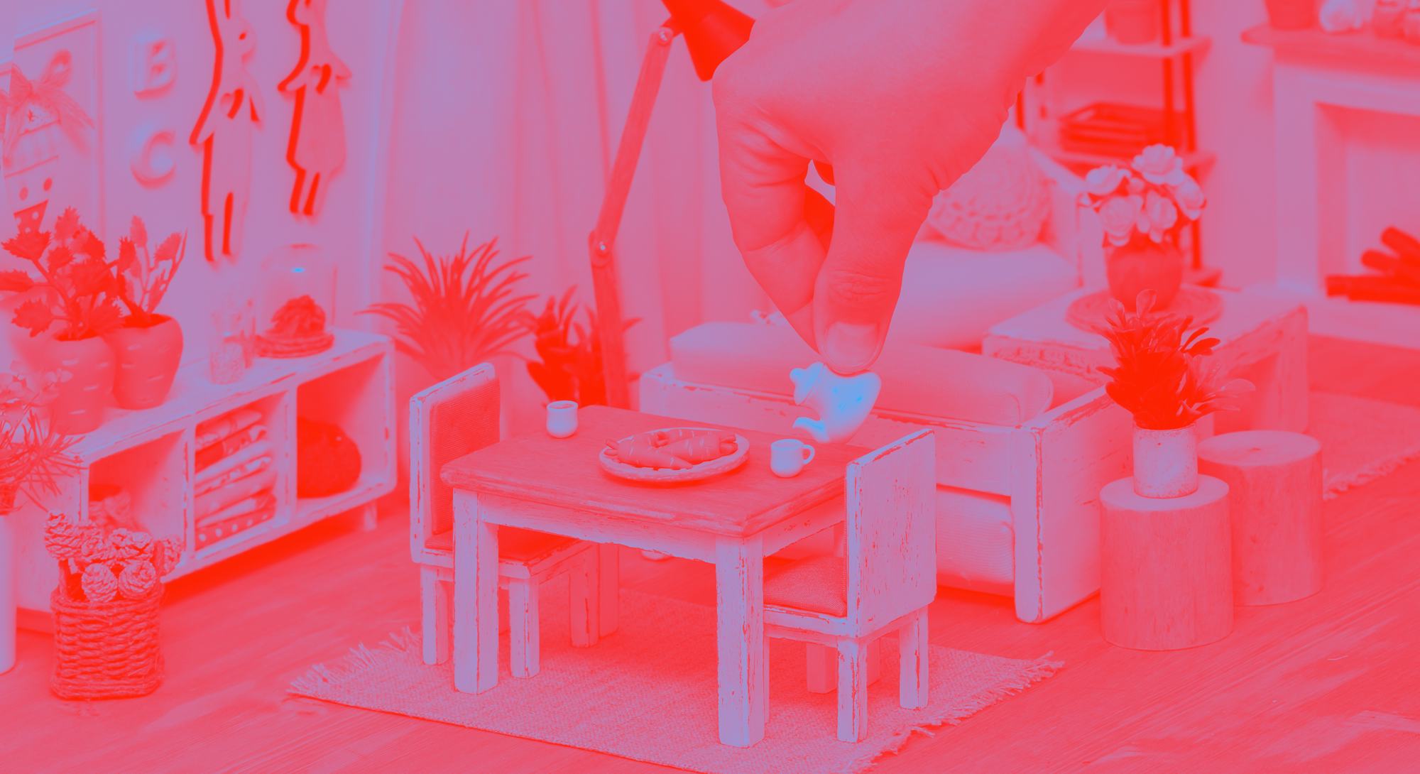 A cheerful bright room in a doll house furnished with miniature furniture, A person serving tea from...