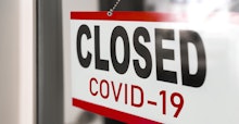 Closed businesses for COVID-19 pandemic outbreak, closure sign on retail store window banner backgro...