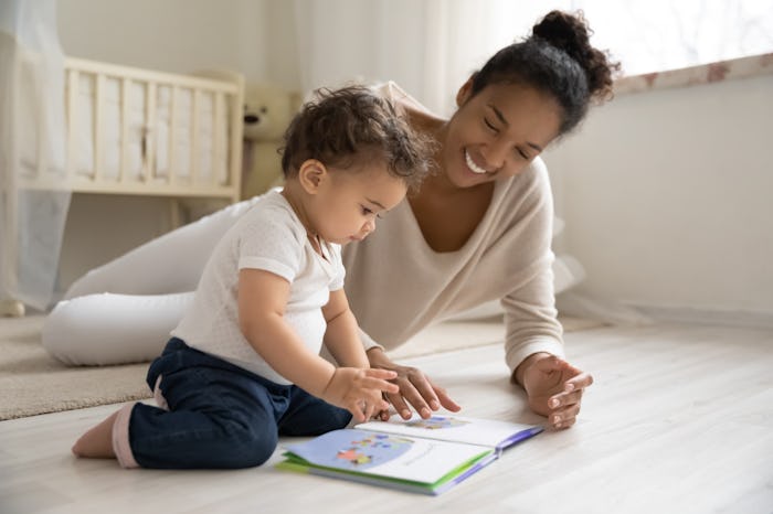 mother reading book with child