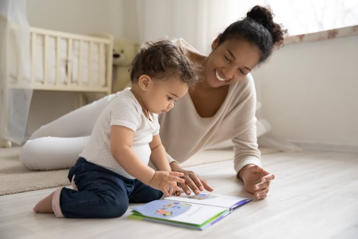 mother reading book with child 