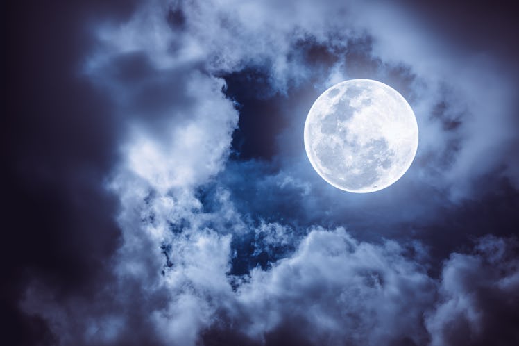 Attractive photo of a nighttime sky with cloudy and bright full moon. Beautiful nature use as backgr...