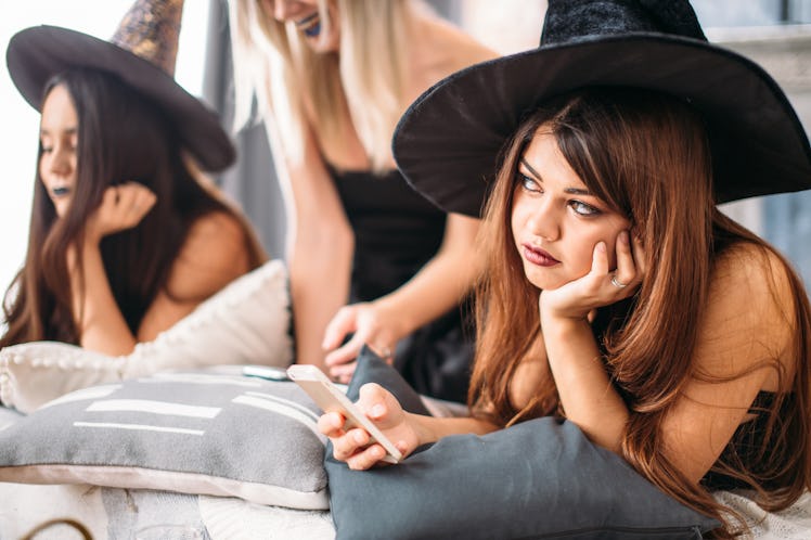 witches use the phone and tire at the Halloween party