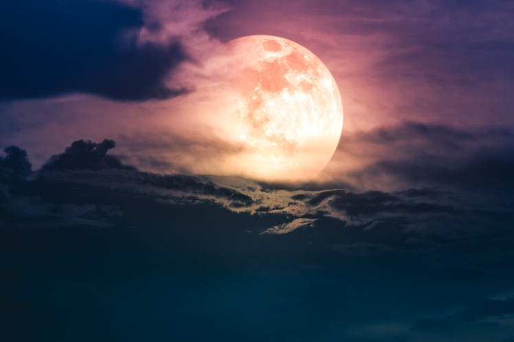 Attractive photo of background nighttime with cloudy. Night sky with beautiful super moon behind clo...