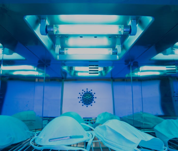 UV light sterilization of face mask to disinfect and reuse. COVID-19 prevention concept. Close up at...