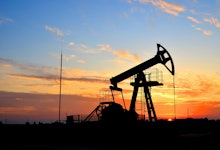 Oil drilling derricks at desert oilfield for fossil fuels output and crude oil production from the g...