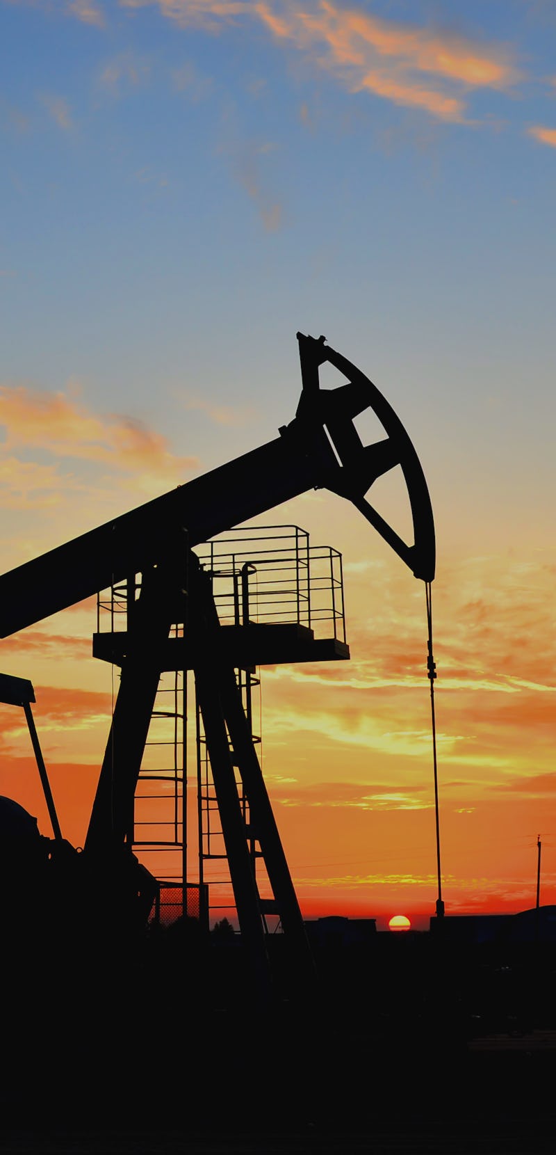 Oil drilling derricks at desert oilfield for fossil fuels output and crude oil production from the g...