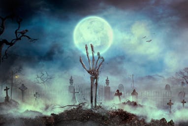 Zombie skeleton hand rise from the grave. Halloween design with zombie graveyard