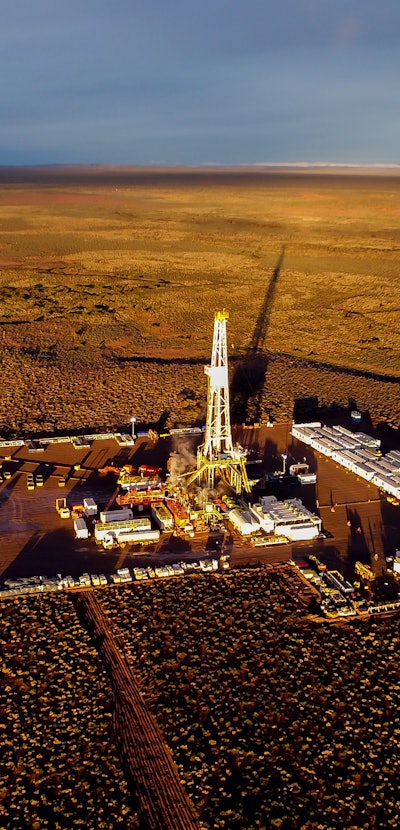 Aerial photo of hydraulic fracturing equipment at sunset. (FRACKING)