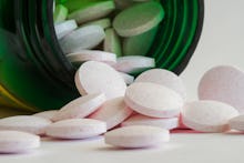 Melatonin Tablets Spilled from the Container