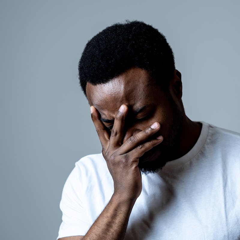 Portrait of attractive man sad and depressed suffering depression feeling sorrow and unpleasant pain...