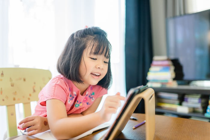 Online education, Online learning.Little asian girl studying homework math during her online lesson ...