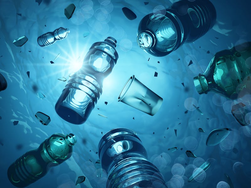 Problem plastic bottles and microplastics floating in the open ocean. Marine plastic pollution conce...