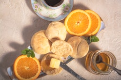 Fresh-baked biscuits with real butter and tupelo honey.  Accompanied by navel orange slices and a ho...