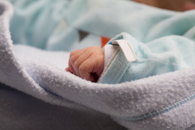 Close up of hand of premature newborn