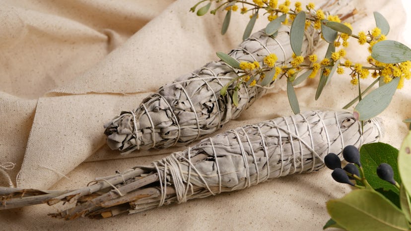 Dried white sage smudge stick, relaxation and aromatherapy. Smudging during psychic occult ceremony,...