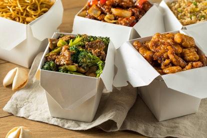 Spicy Chinese Take Out Food with Chopsticks and Fortune Cookies