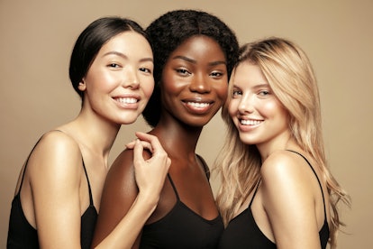 Beauty. Multi Ethnic Group of Womans with diffrent types of skin together and looking on camera. Div...