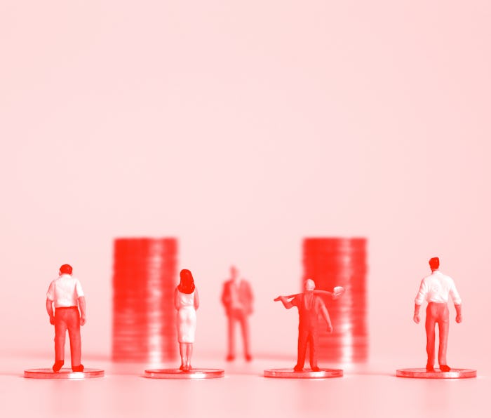 Miniature people with piles of coins. The concept of workers demanding a minimum wage increase.