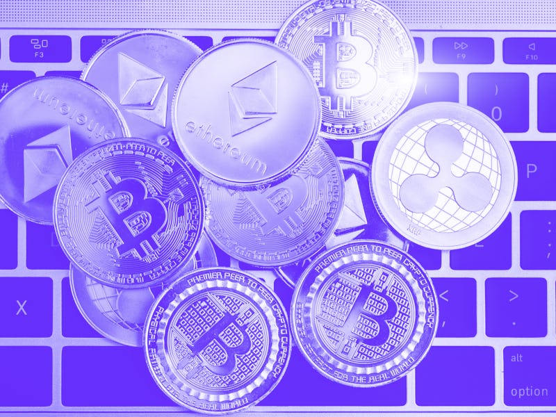 Virtual ripple XRP, Ethereum and Bitcoin coins currency finance money stack together on keyboard of ...