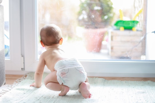 baby crawling in diaper