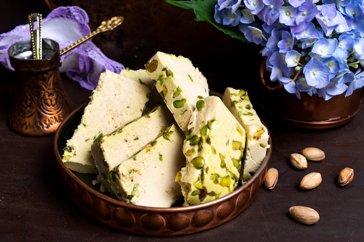 halva on a plate with flowers and nuts
