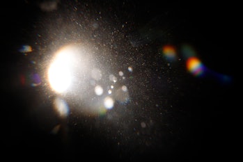 Lens Flare. Light over black background. Easy to add overlay or screen filter over photos. Abstract ...