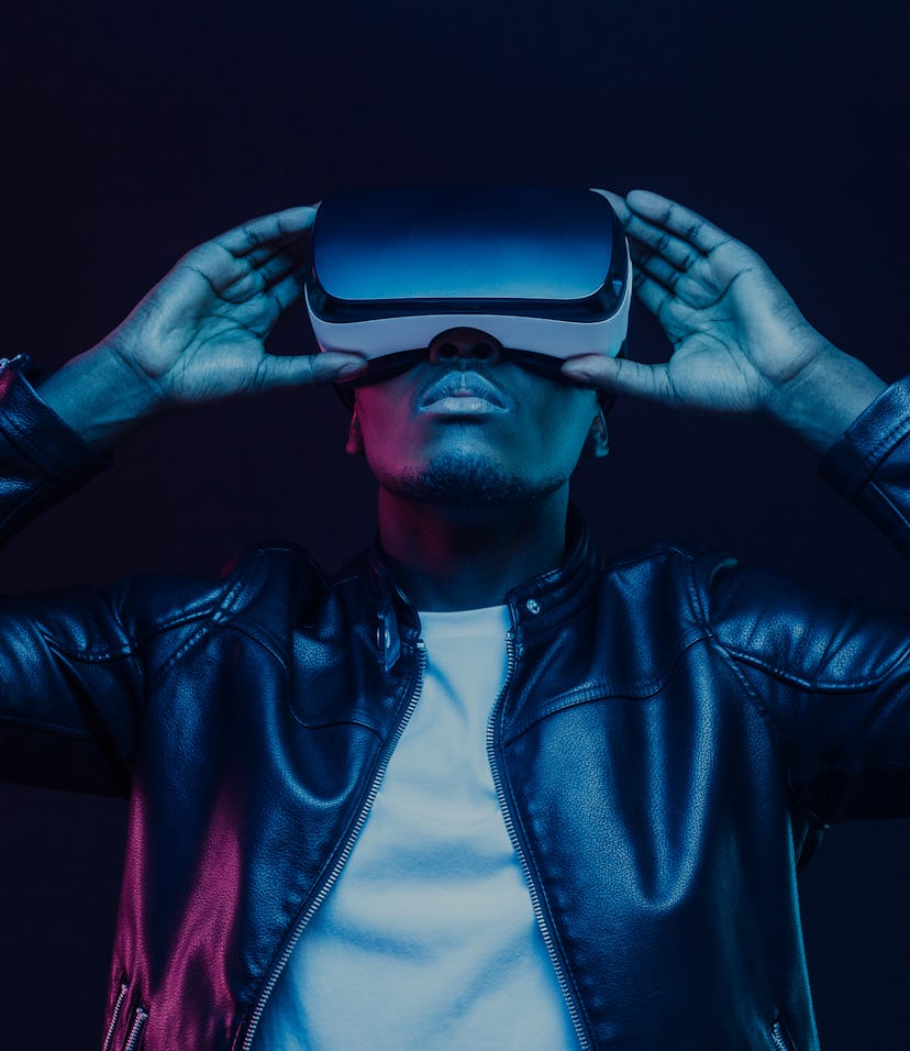 African american man in vr glasses, watching 360 degree video with virtual reality headset isolated ...