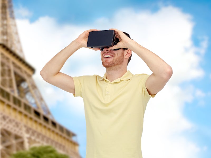 3d technology, virtual reality, travel, entertainment and people concept - happy young man with virt...