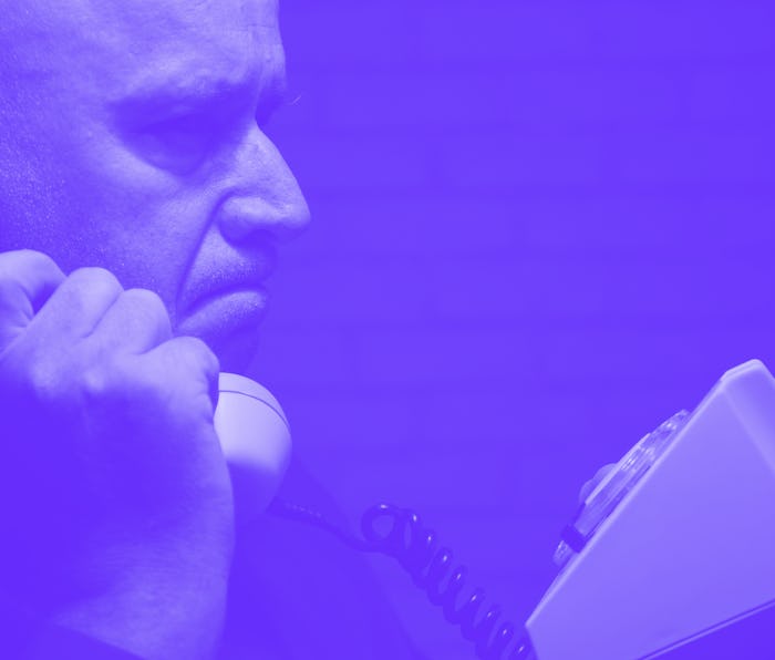 Image with a Disappointed Businessman Making a Phone Call