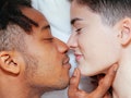 Mixed race couple having an intimate moment on the bedroom. lifestyle at home. Young people.