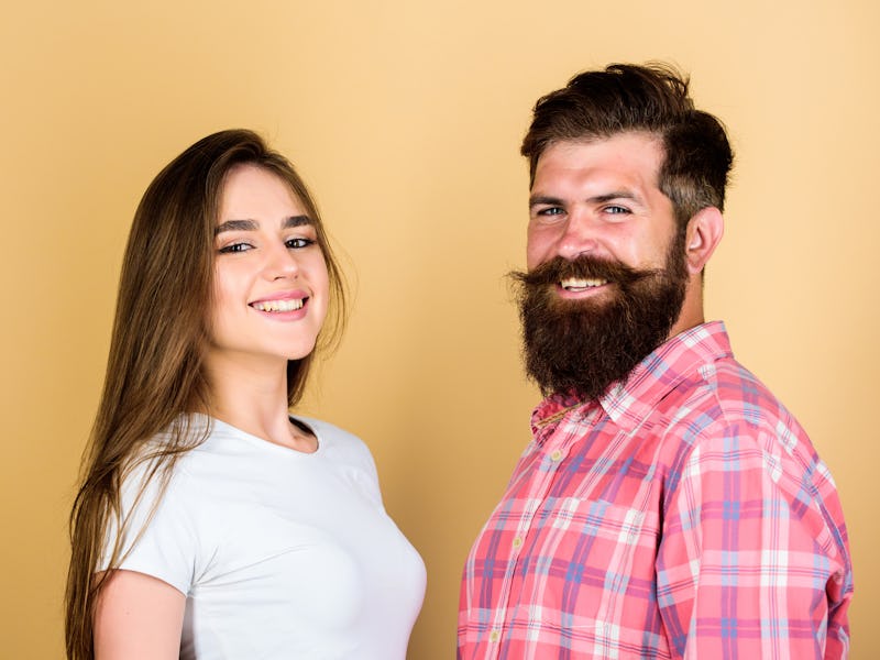 Life together. happy couple. couple in love. bearded man hipster with girl. hairdresser and barber c...