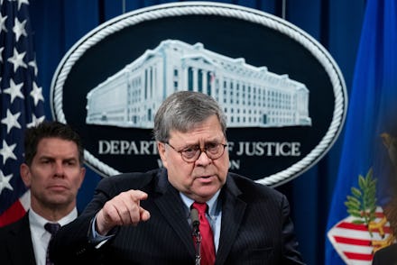US Attorney General William Barr participates in a news conference in front of FBI Deputy Director D...