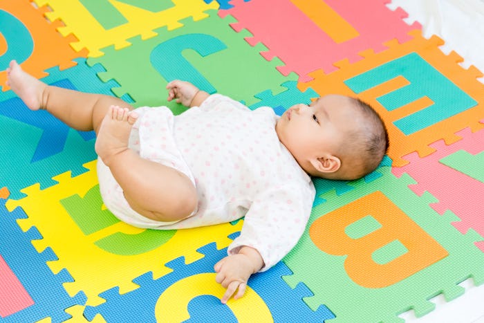 Portrait of adorable baby lying on back