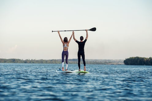 Stand up paddleboard beach people on paddle board