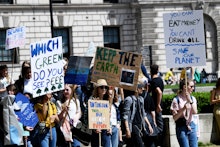 School students walk out in global climate strike, Parliament Square, London.