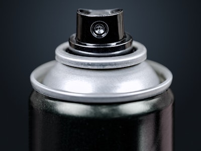 Spray Can Macro, Isolated on Black. Close up on the Nozzle