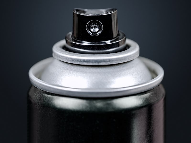 Spray Can Macro, Isolated on Black. Close up on the Nozzle