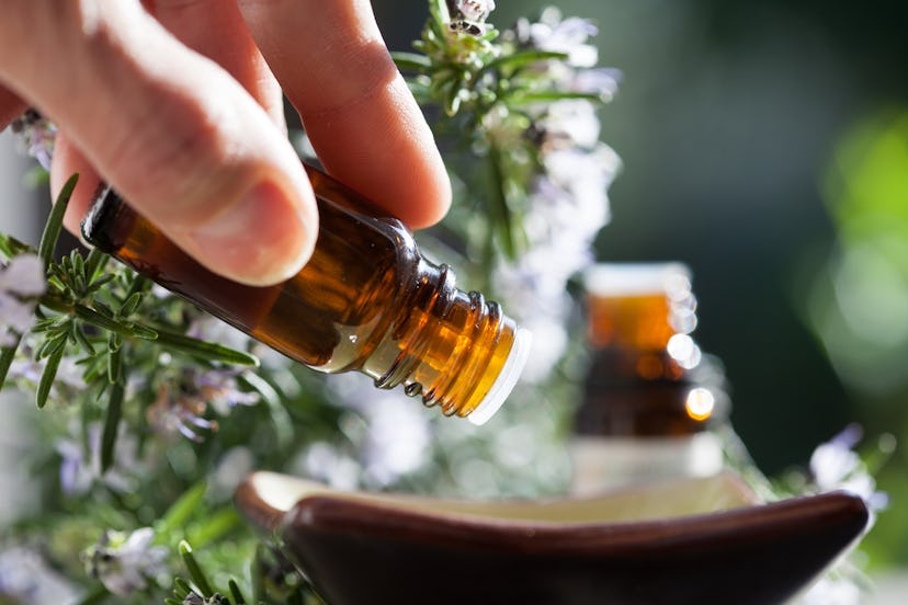 pour rosemary essential oil in a bowl