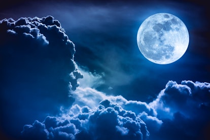Super moon. Attractive photo of background night sky with cloudy and bright full moon. Nightly sky w...