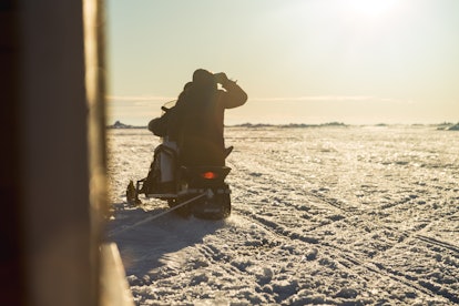 A snowmobiler navigates the ice near Iqaluit, Nunavut.